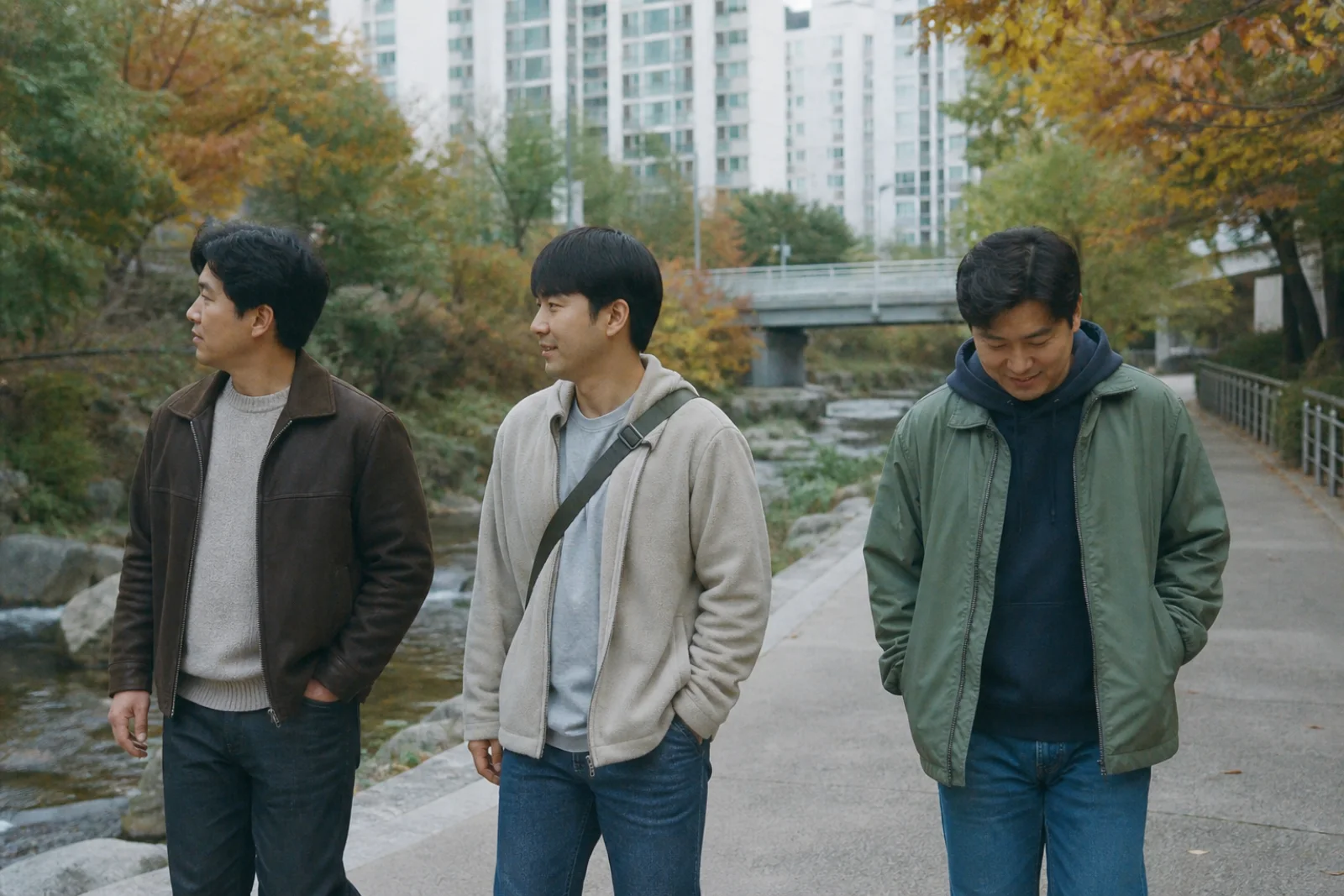 Seoul friends walking beside autumn trees with ordinary city buildings beyond