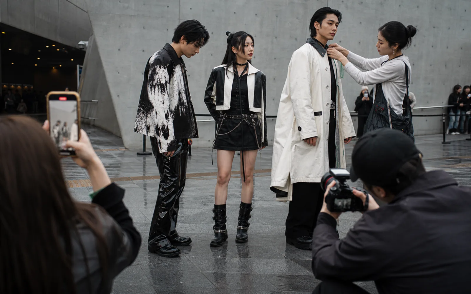 Generic Korean and diaspora fashion creatives being photographed outside a Seoul venue