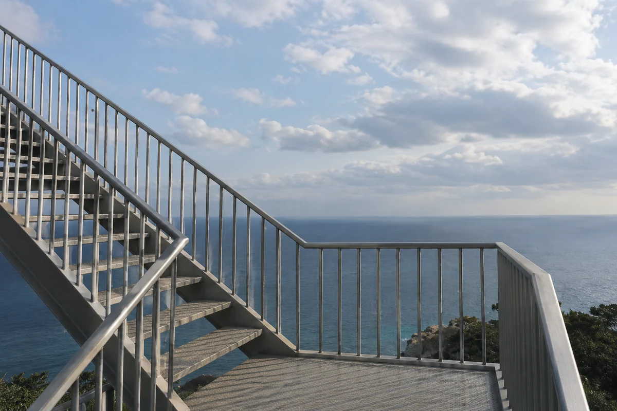 Conceptual ordinary steel stair landing overlooking a distant sea