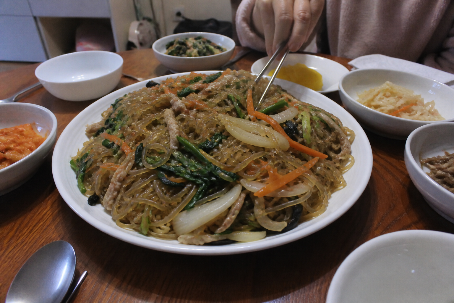 A natural AI-generated SEOULIAN editorial photograph illustrating Japchae